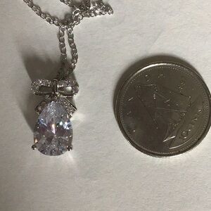 2/$15 Charmed Aroma 925 silver bow necklace. Clear stones.